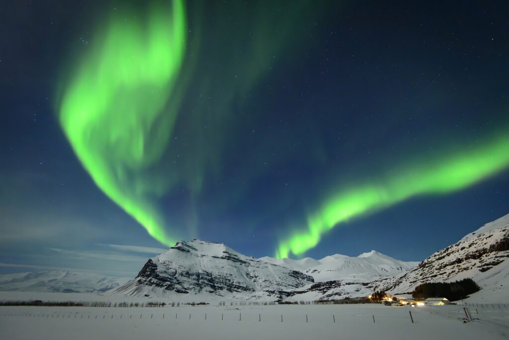 A vibrant aurora lighting up the Reykjavik skyline